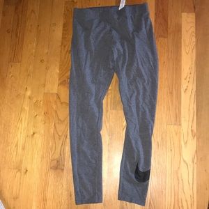 Grey Nike leggings with check on calf